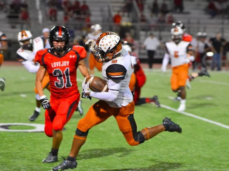 West Mesquite High School player running with ball