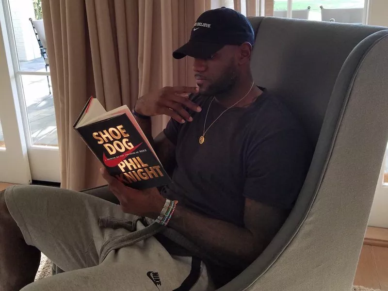 LeBron James reading Phil Knight's book