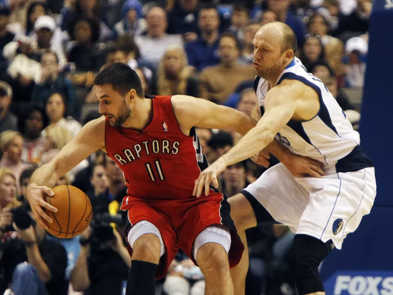 Dallas Maverick Brian Cardinal and Toronto Raptor Linas Kleiza in action