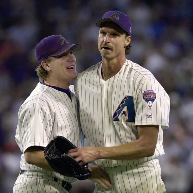 Randy Johnson congratulated by Curt Schilling