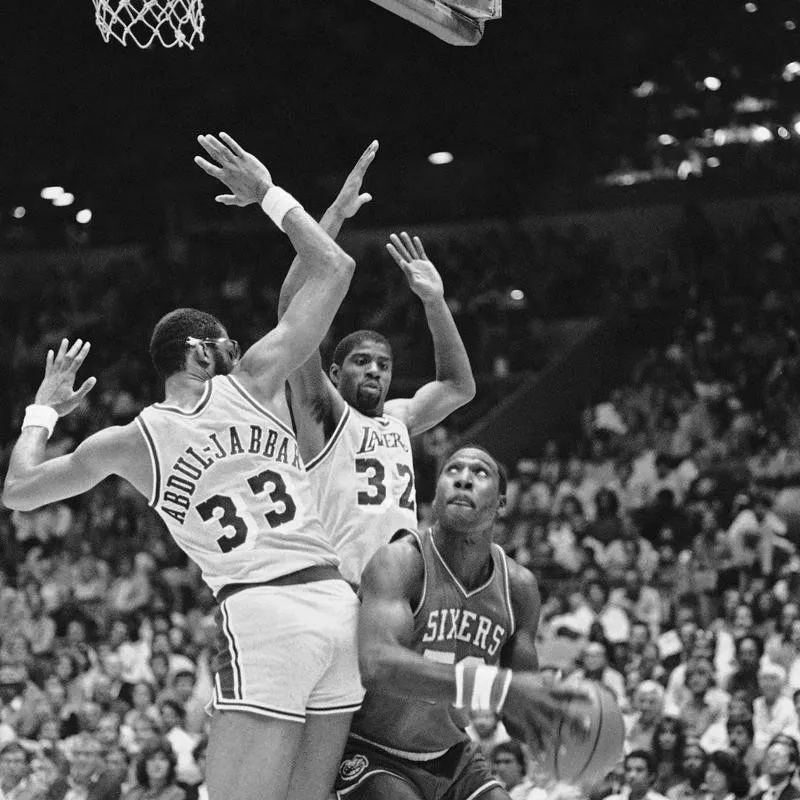 Kareem Abdul-Jabbar and Earvin Magic Johnson play defense