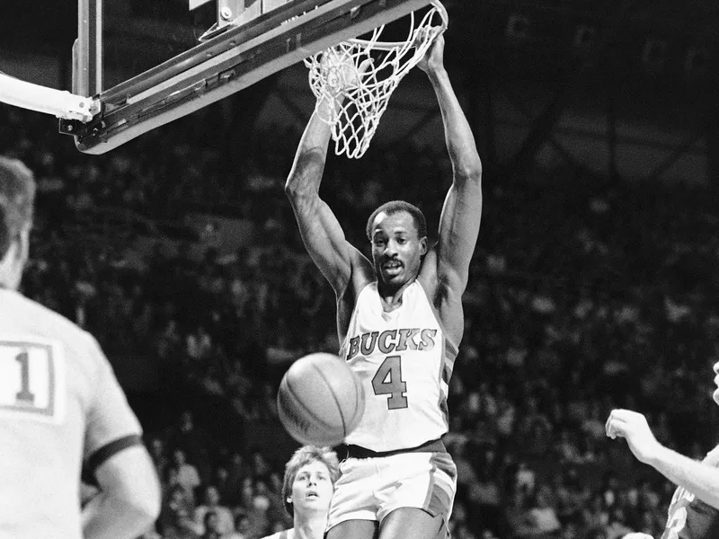 Sidney Moncrief dunks over Danny Ainge