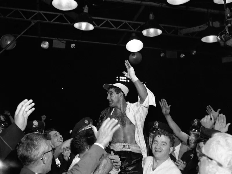 Rocky Marciano waves to crowd