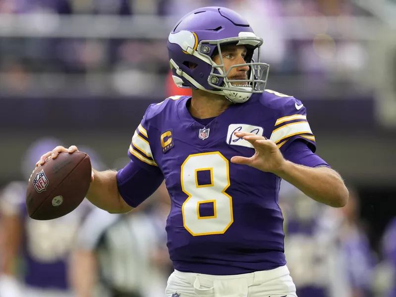 Minnesota Vikings quarterback Kirk Cousins throws pass