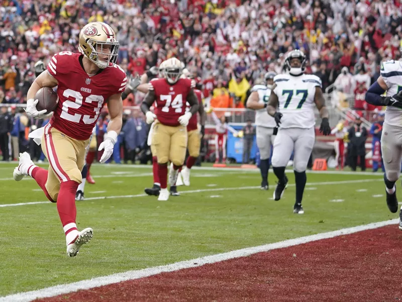 San Francisco 49ers running back Christian McCaffrey scores a touchdown