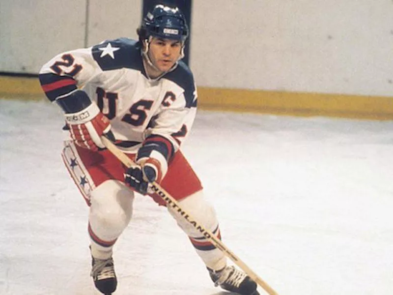 Mike Eruzione skating with puck