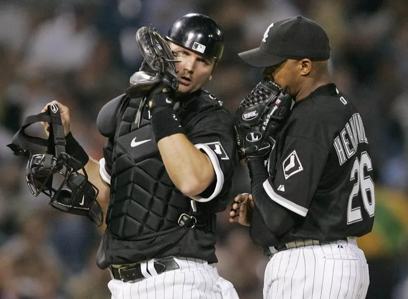 A. J. Pierzynski meets with Orlando Herandez on mound