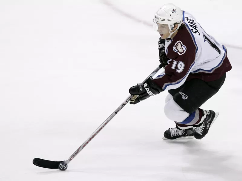 Colorado Avalanche center Joe Sakic controls the puck