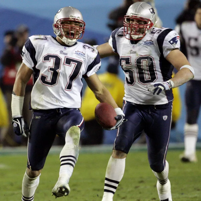 New England Patriots Rodney Harrison celebrates interception