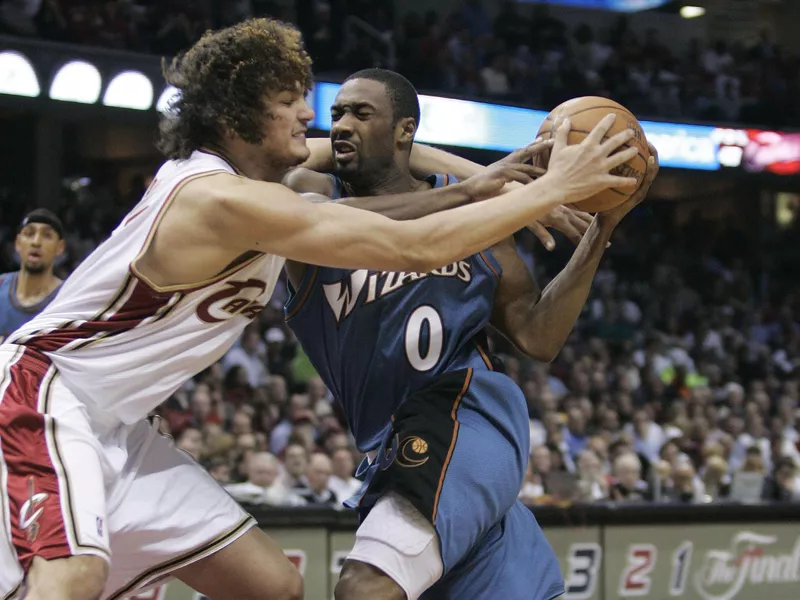 Washington Wizards' Gilbert Arenas stopped by Anderson Varejao