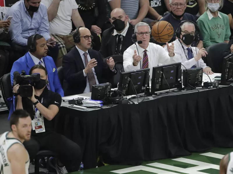 Jeff Van Gundy, Mike Breenmiddle, and Mark Jackson watch