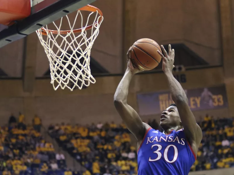 Kansas guard Ochai Agbaji shoots against West Virginia