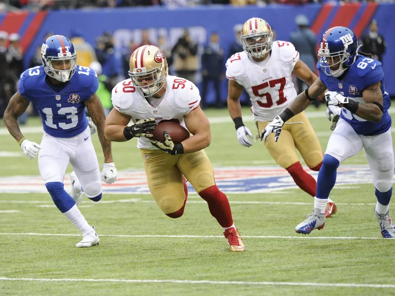 Chris Borland runs back an interception