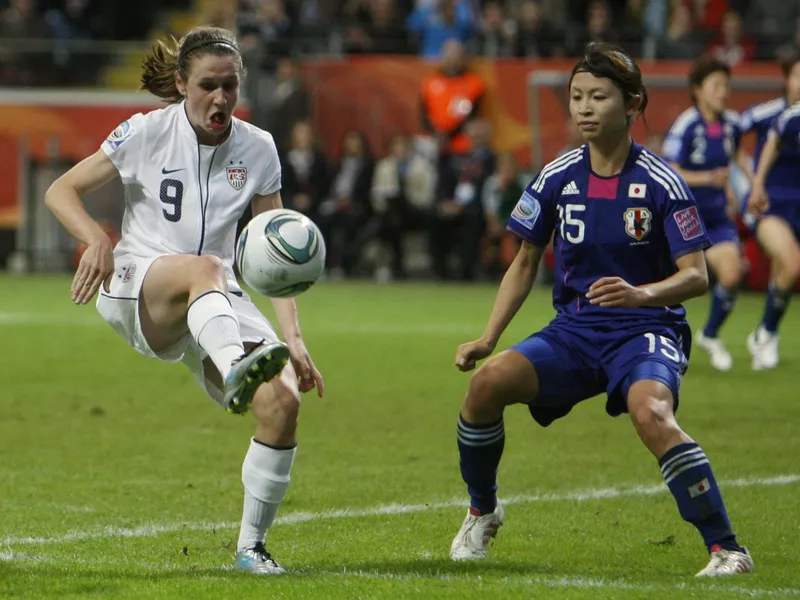 United States' Heather O Reilly, left, kicks the ball against Japan's Aya Sameshima in the 2011 Women's World Cup