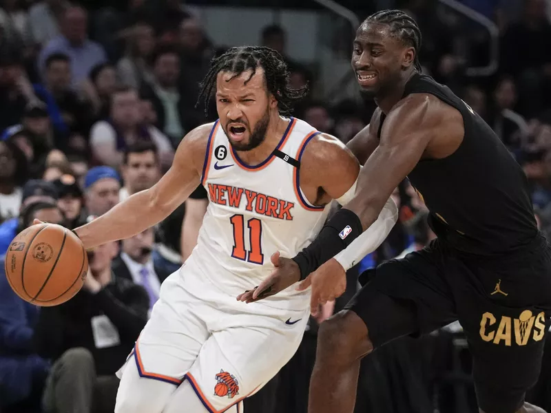 New York Knicks point guard drives past Cleveland Cavaliers shooting guard Caris LeVert