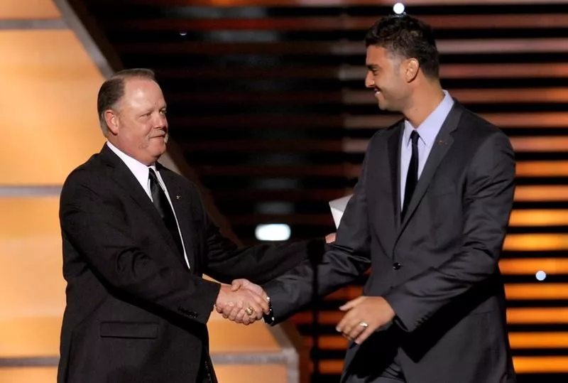 MLB umpire Jim Joyce shakes hands with Armando Galarraga of the Detroit Tigers