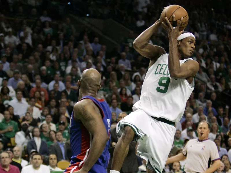 Boston Celtics guard Rajon Rondo looks up court alongside Chauncey Billups