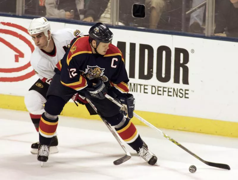 Florida Panthers Olli Jokinen, right, battles Wade Redde for the puck