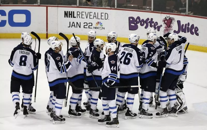 Winnipeg Jets players celebrate team win