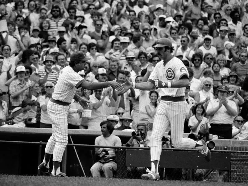 Dave Kingman congratulated by third base coach Joe Amalfitano