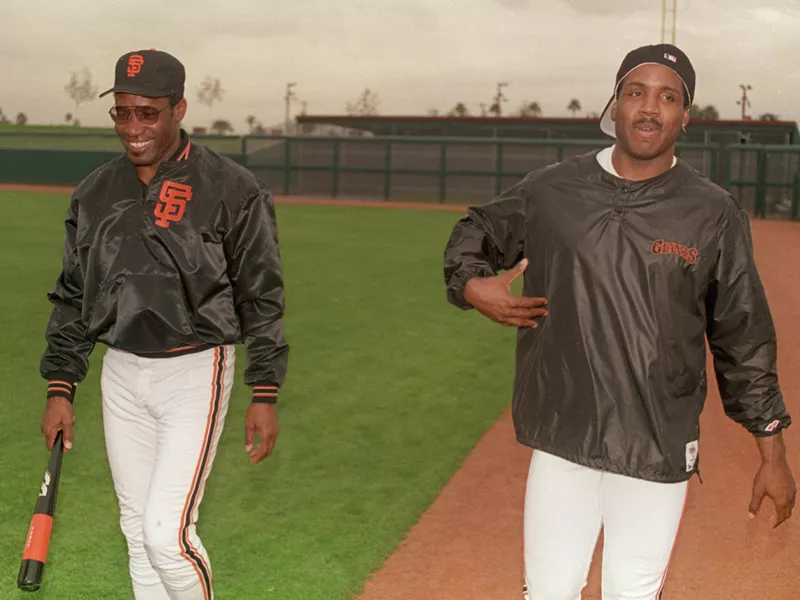 San Francisco Giants coach Bobby Bonds follows his son Barry,