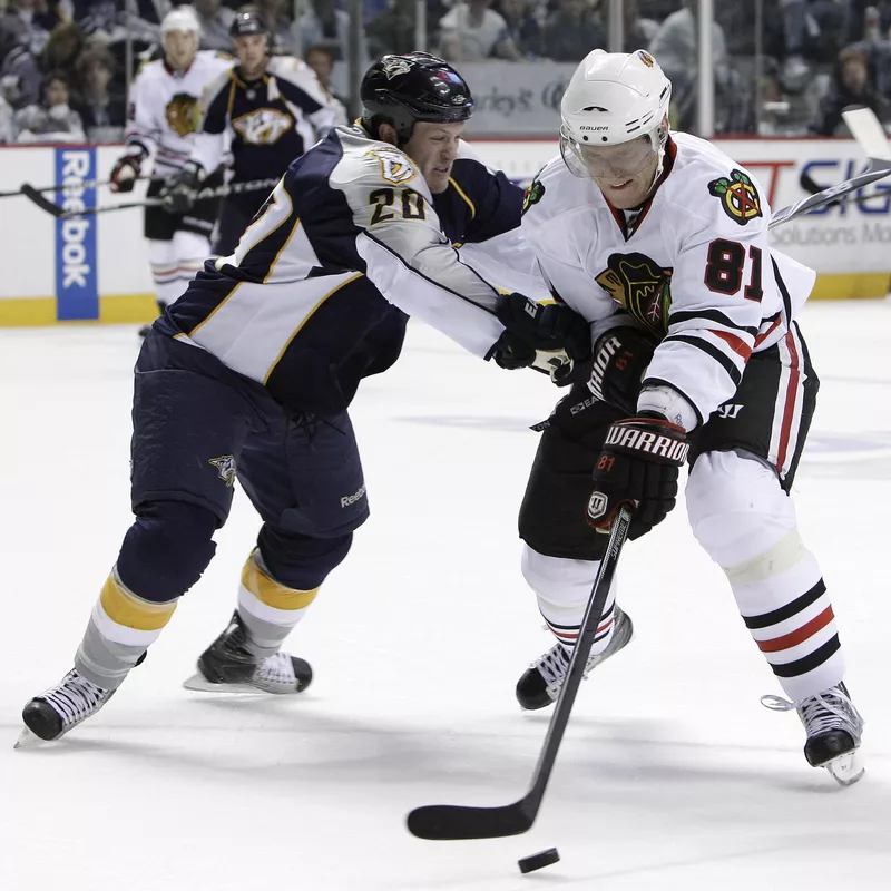 Nashville Predators defenseman Ryan Suter checks Marian Hossa