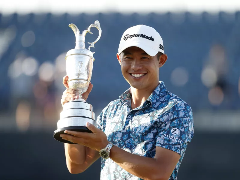 United States' Collin Morikawa holds claret jug trophy