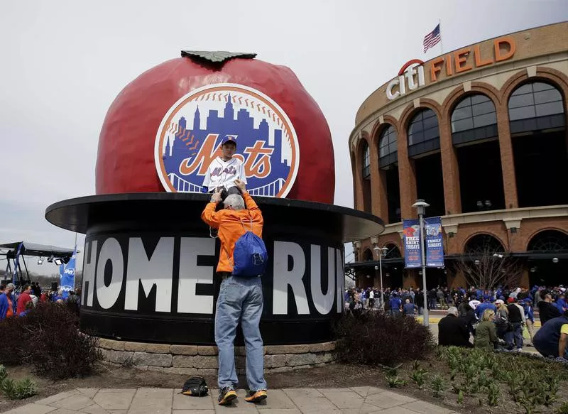 Fan on apple outside Citi Field