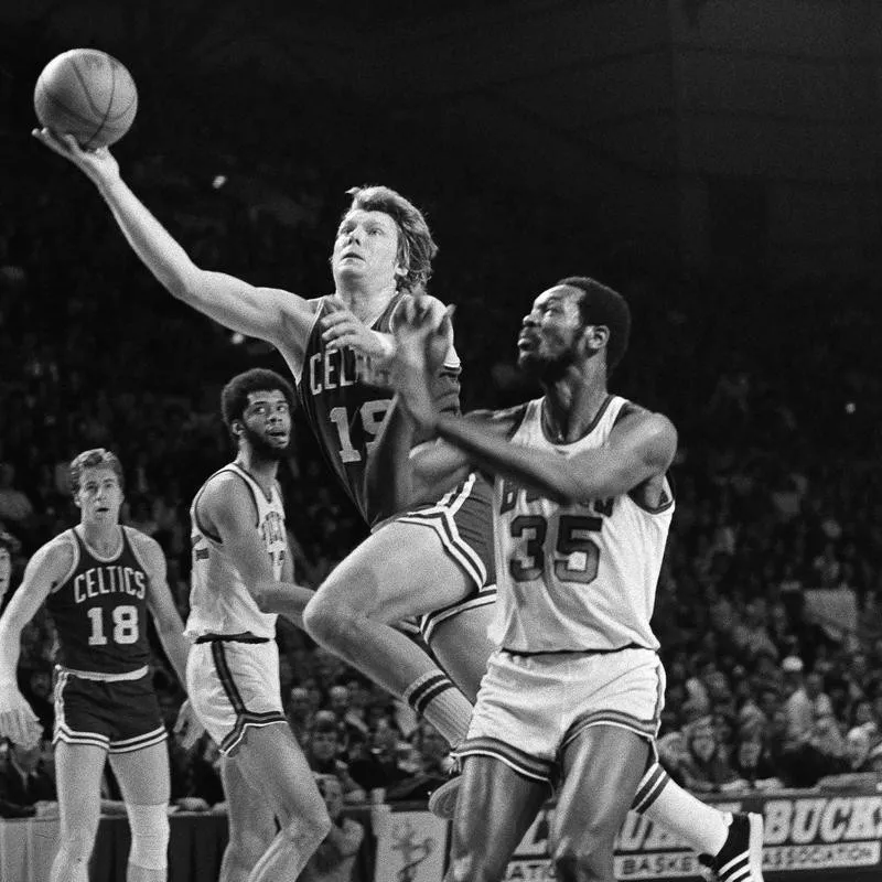 Boston Celtics' Don Nelson takes off