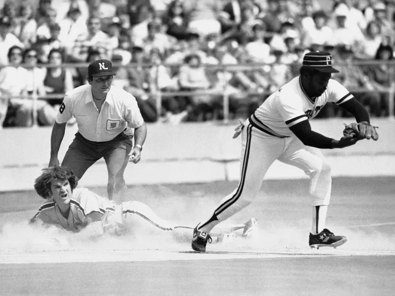 Pittsburgh Pirates third baseman Bill Madlock catches a throw