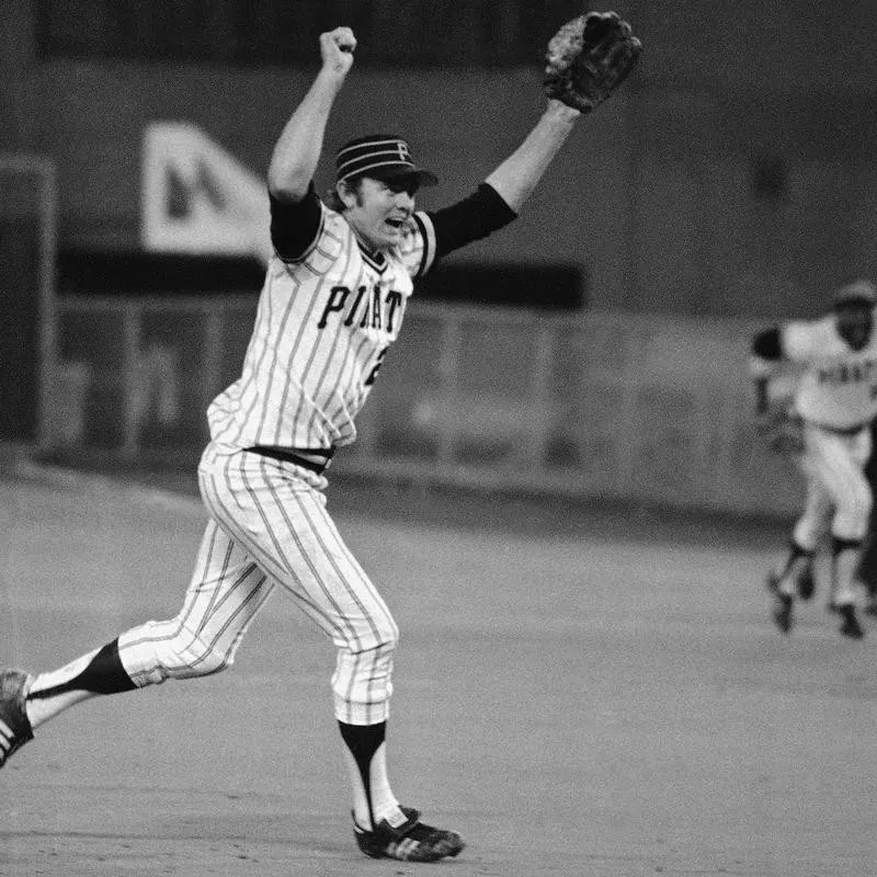 Pirates pitcher Bert Blyleven raises his arms