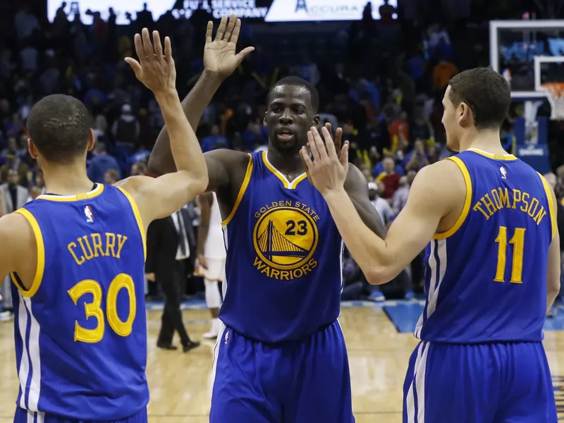 Stephen Curry, Draymond Green, Klay Thompson celebrate