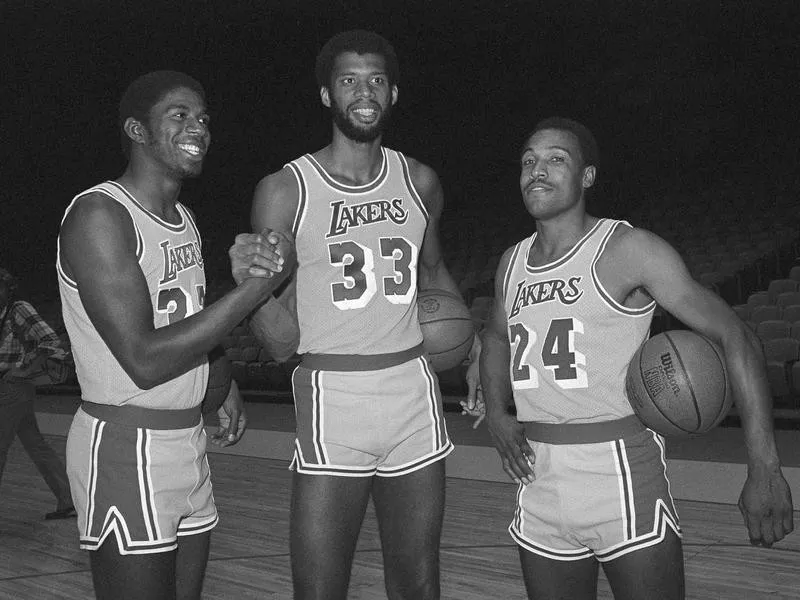 Magic Johnson greets Kareem Abdul-Jabbar during Lakers photo day