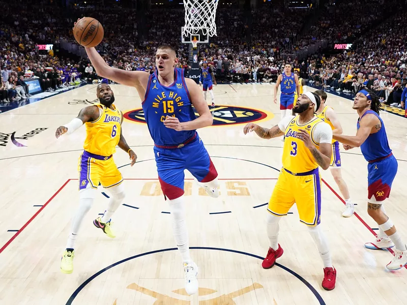 Denver Nuggets center Nikola Jokic pulls down a rebound