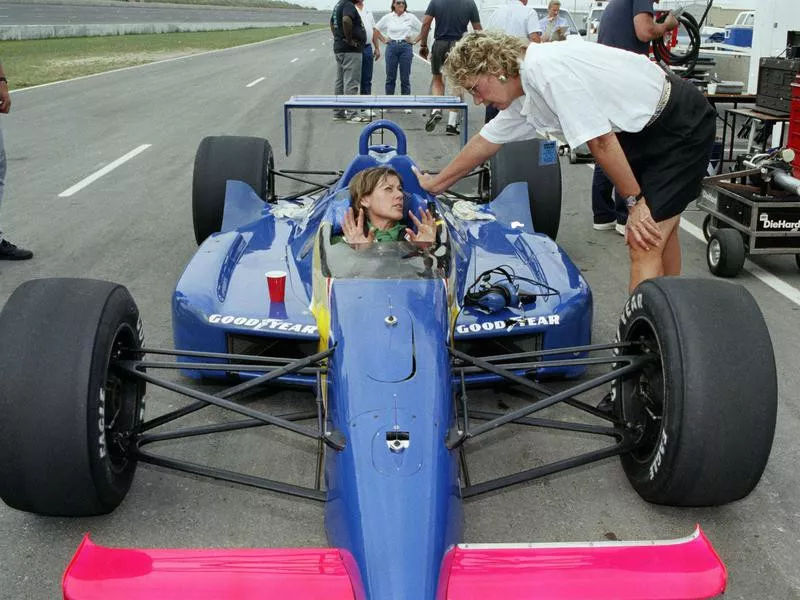 Lyn St. James sits in car