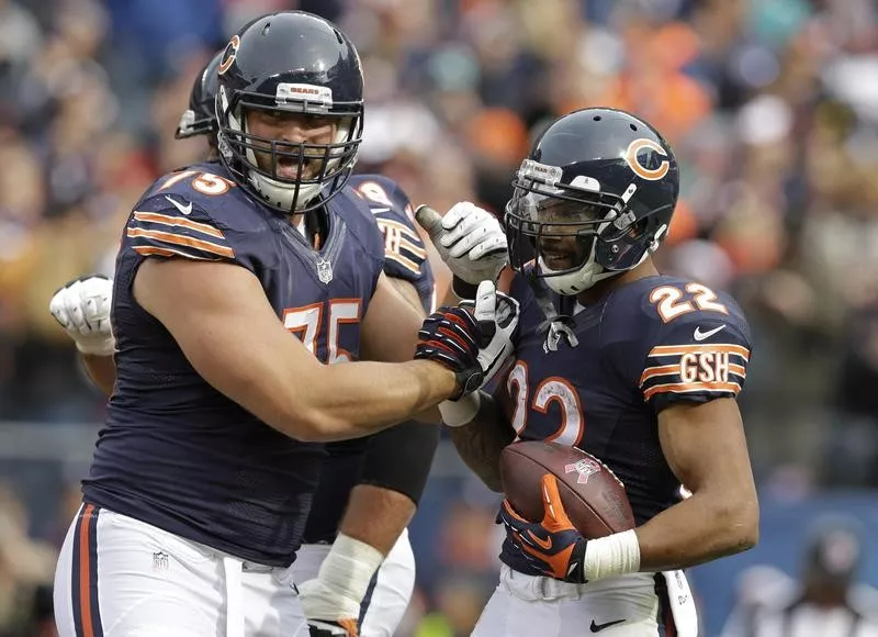 Kyle Long celebrates with Chicago Bears teammate Matt Forte