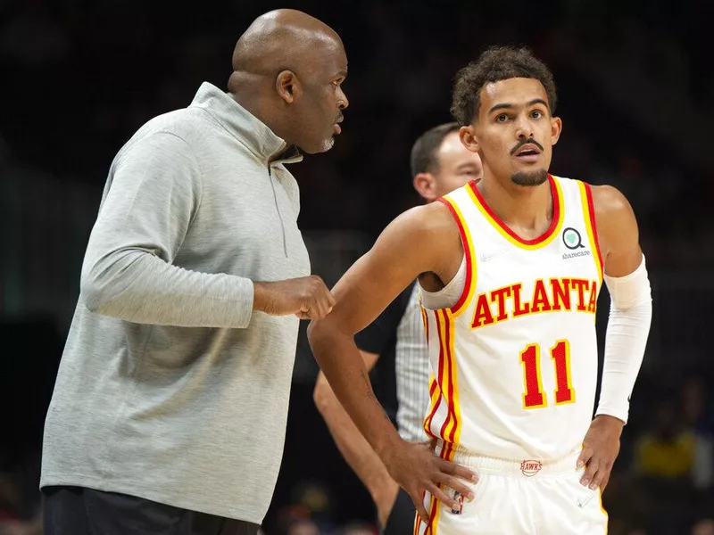 Atlanta Hawks head coach Nate McMillan and Trae Young