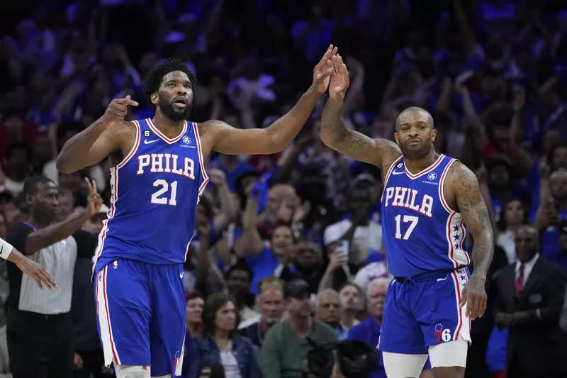 Philadelphia 76ers center Joel Embiid and guard P.J. Tucker celebrate