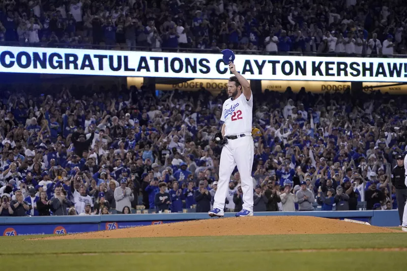 Los Angeles Dodgers starting pitcher Clayton Kershaw tips his cap