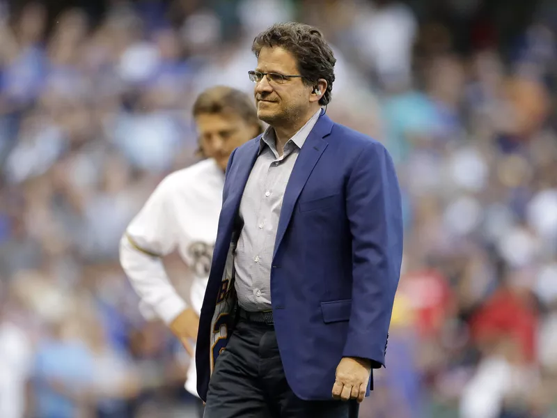 Milwaukee Brewers' owner Mark Attanasio walks off field