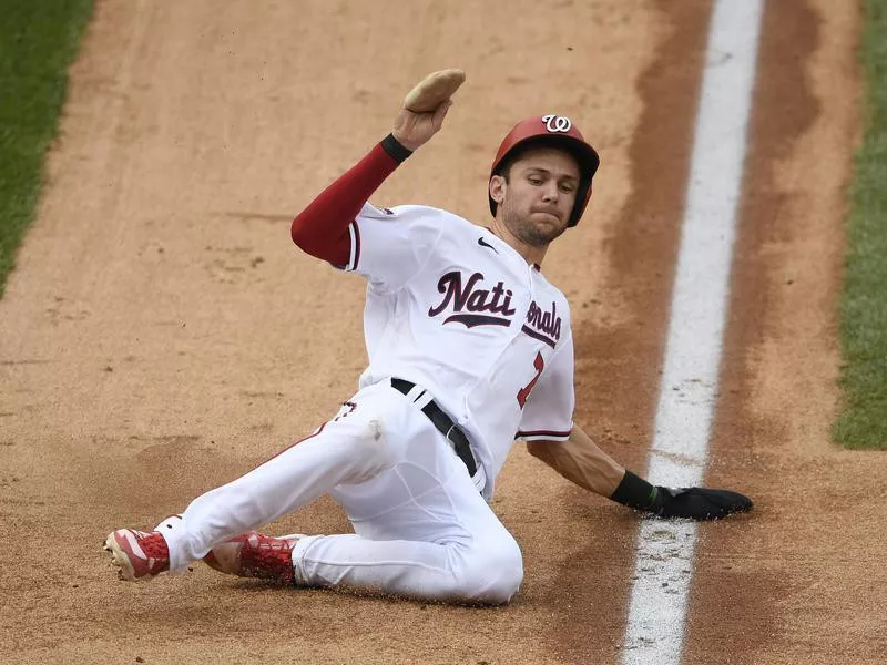 Washington Nationals' Trea Turner slides home