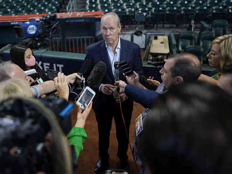 Jim Crane speaks to reporters