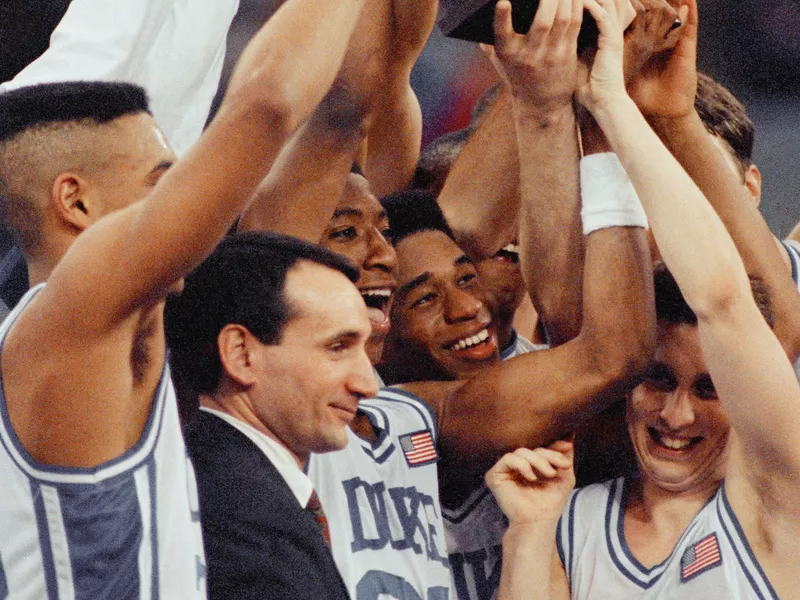 Duke coach Mike Krzyzewski and players celebrate