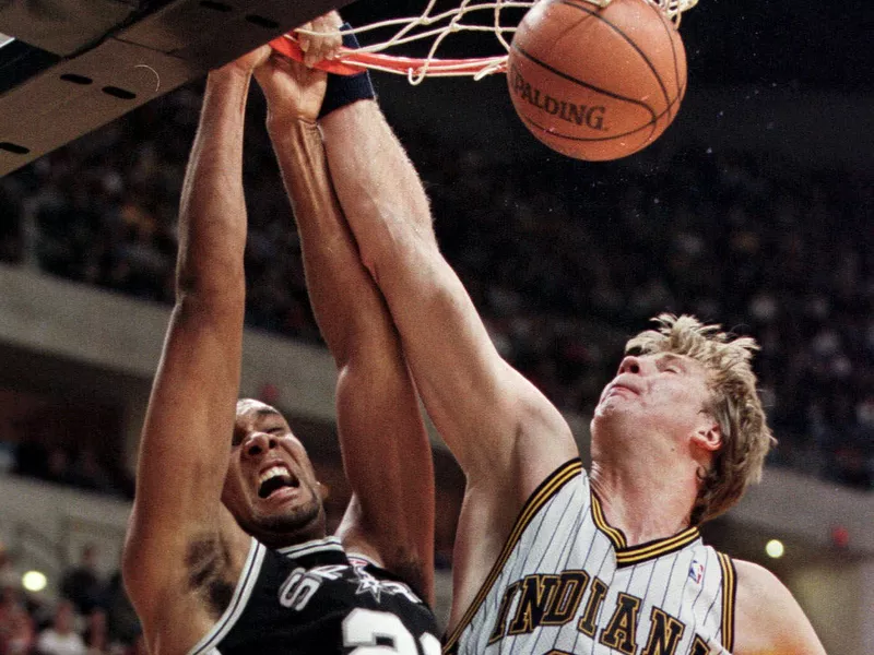 Tim Duncan slam dunks ball