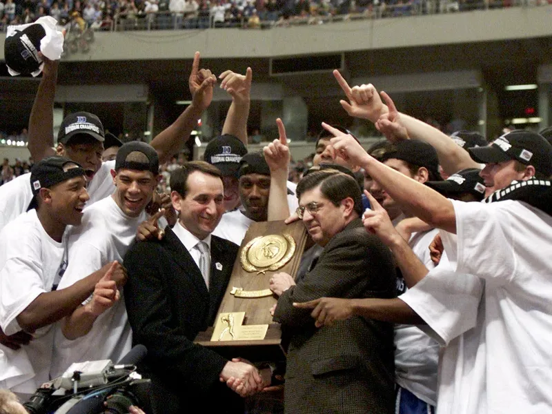 Duke head coach Mike Krzyzewski and Blue Devils players celebrate