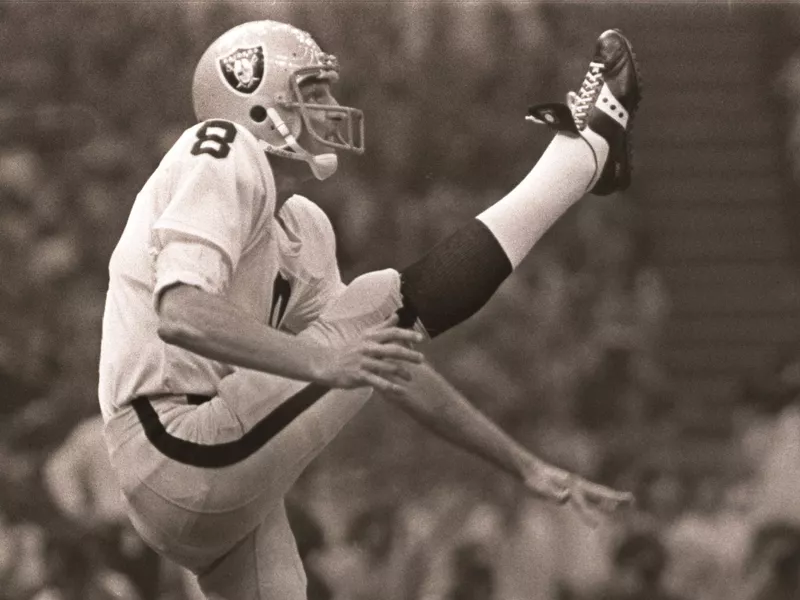 Oakland Raiders punter Ray Guy kicks