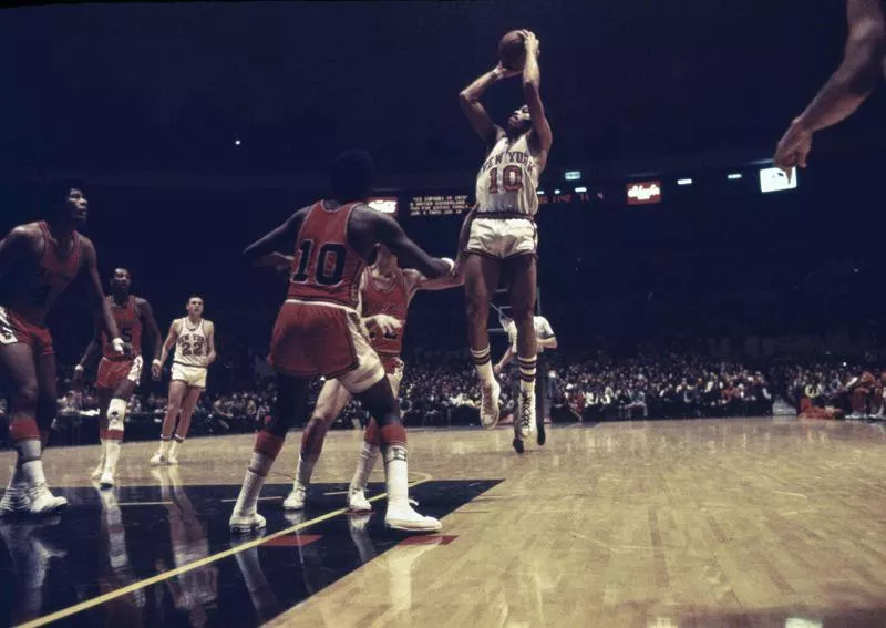 New York Knicks guard Walt Frazier pulls up for a jump shot