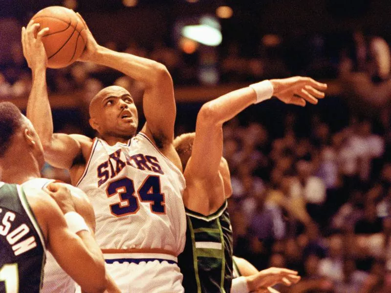 Philadelphia 76ers forward Charles Barkley crashes through the defense of Milwaukee Bucks