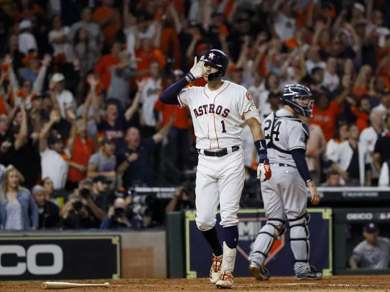 Carlos Correa celebrates after walk-off home run