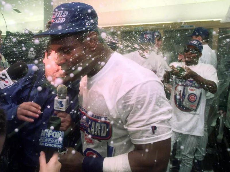 Sammy Sosa celebrates in locker room